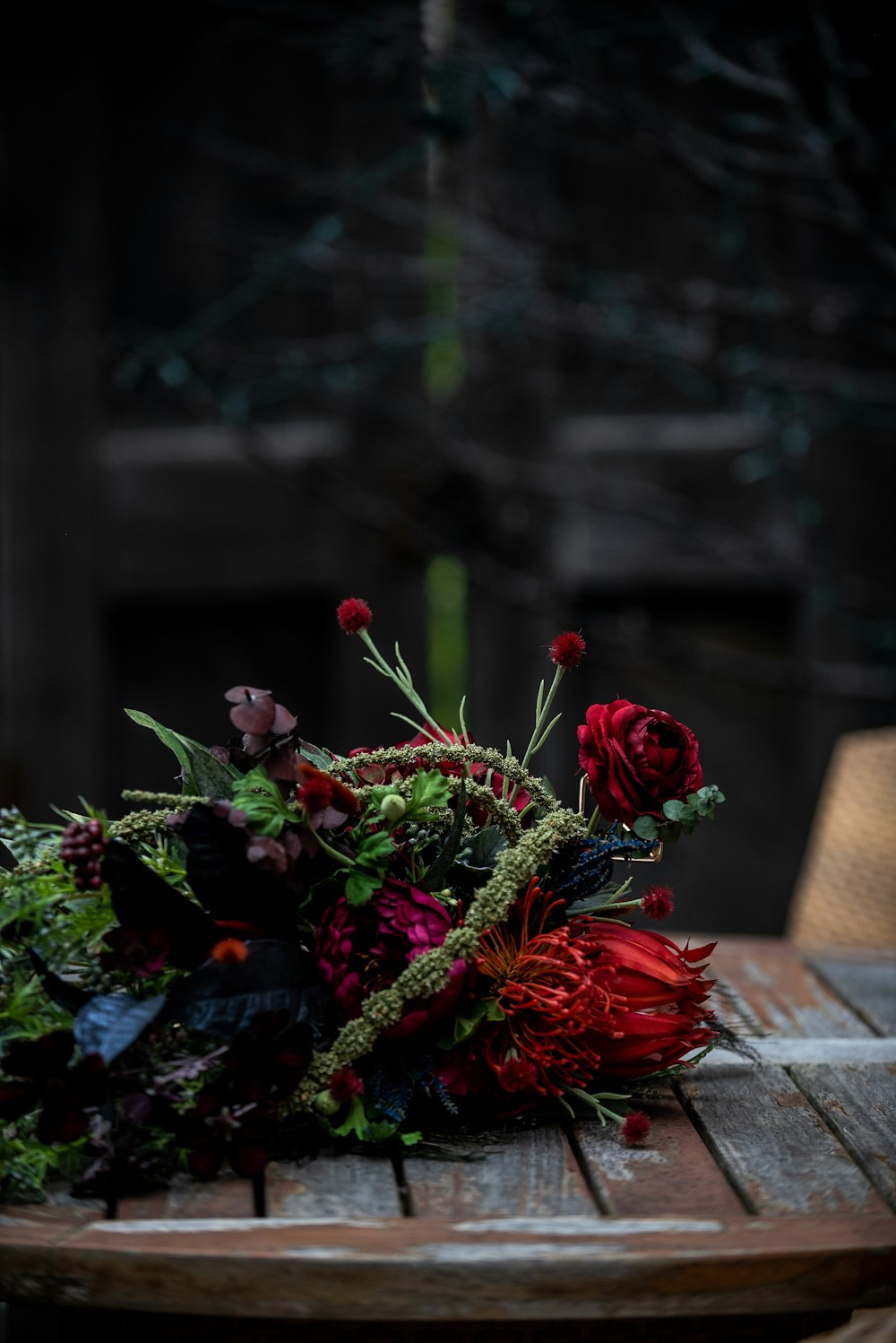 red flowers on brown clay pot