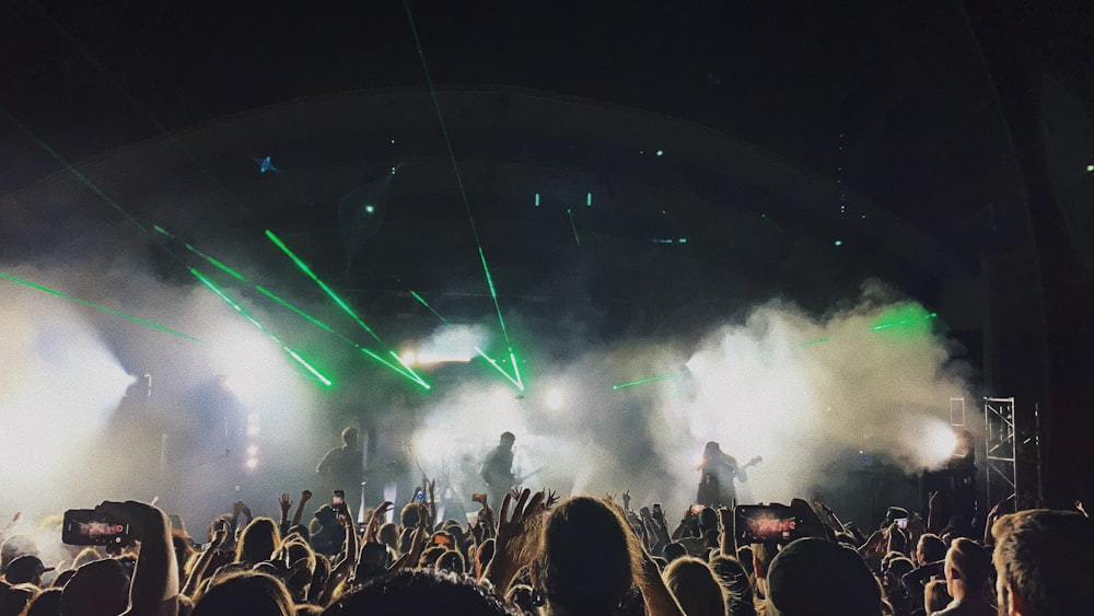 people watching concert during night time