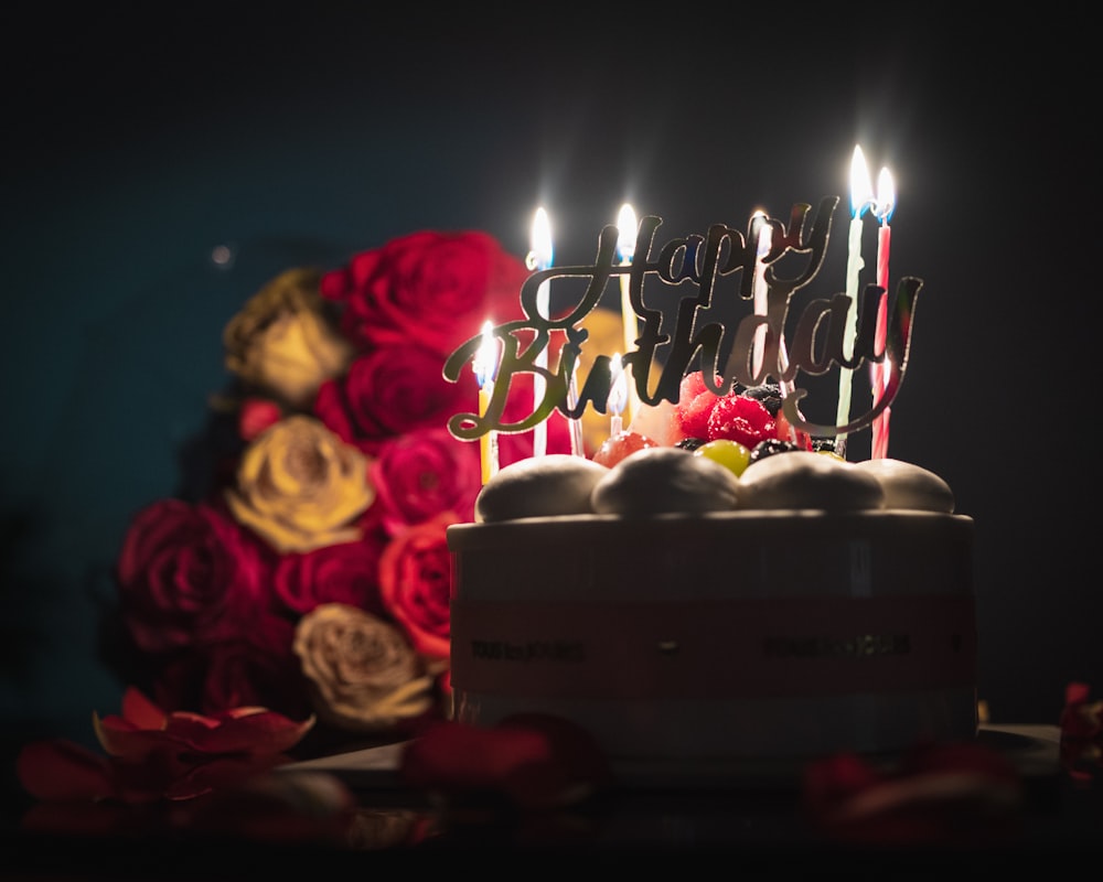 pink and white candles on cake