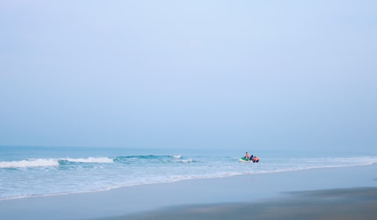 person surfing on sea during daytime in Goa India