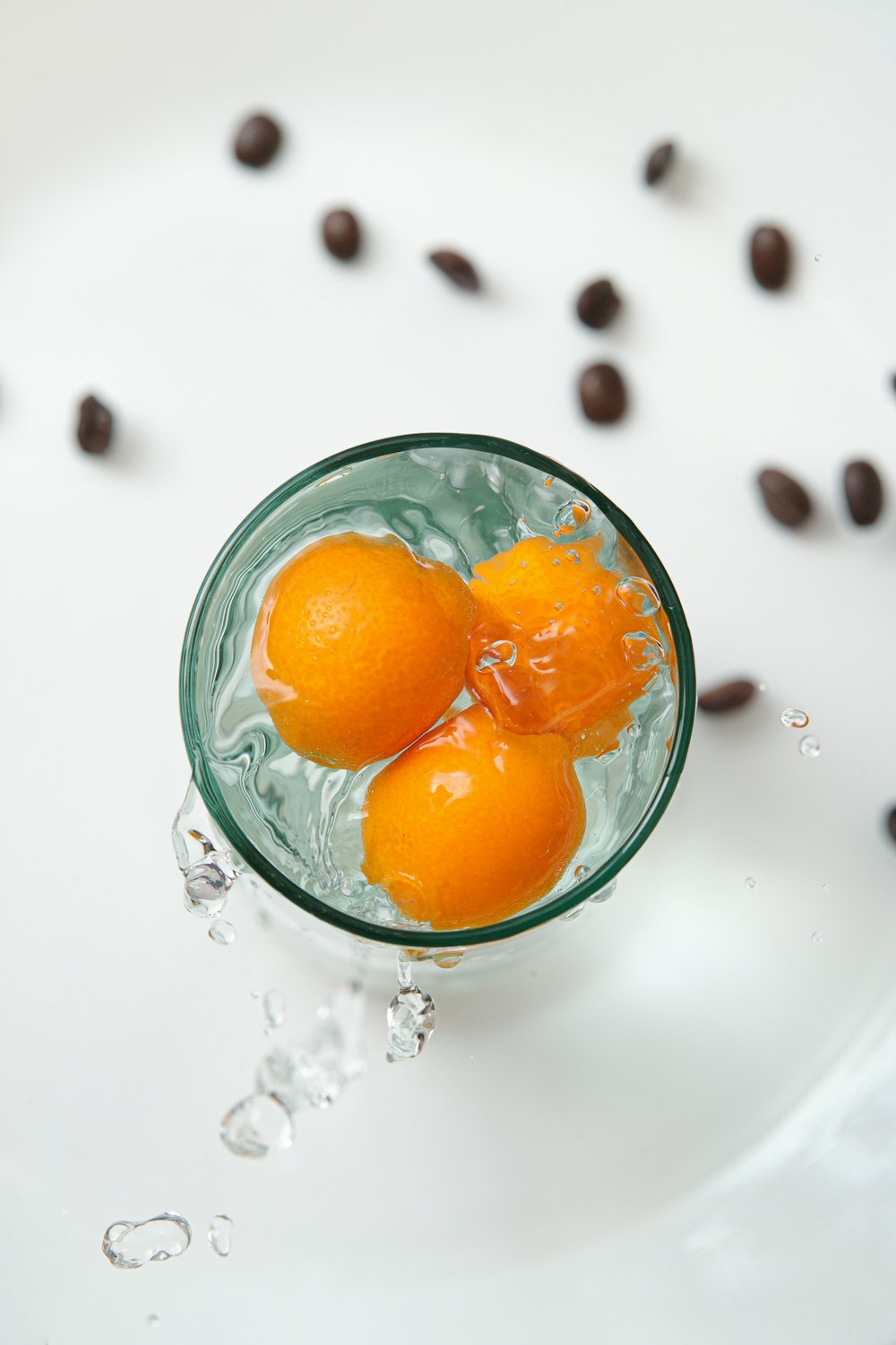 orange fruit in clear glass bowl