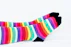 a pair of colorful socks sitting on top of a bed
