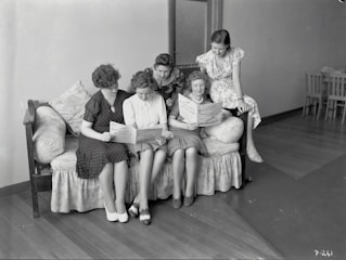 A group of women engaged in a reading circle.