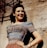 A smiling woman wearing a stylish outfit from Amoria Style.