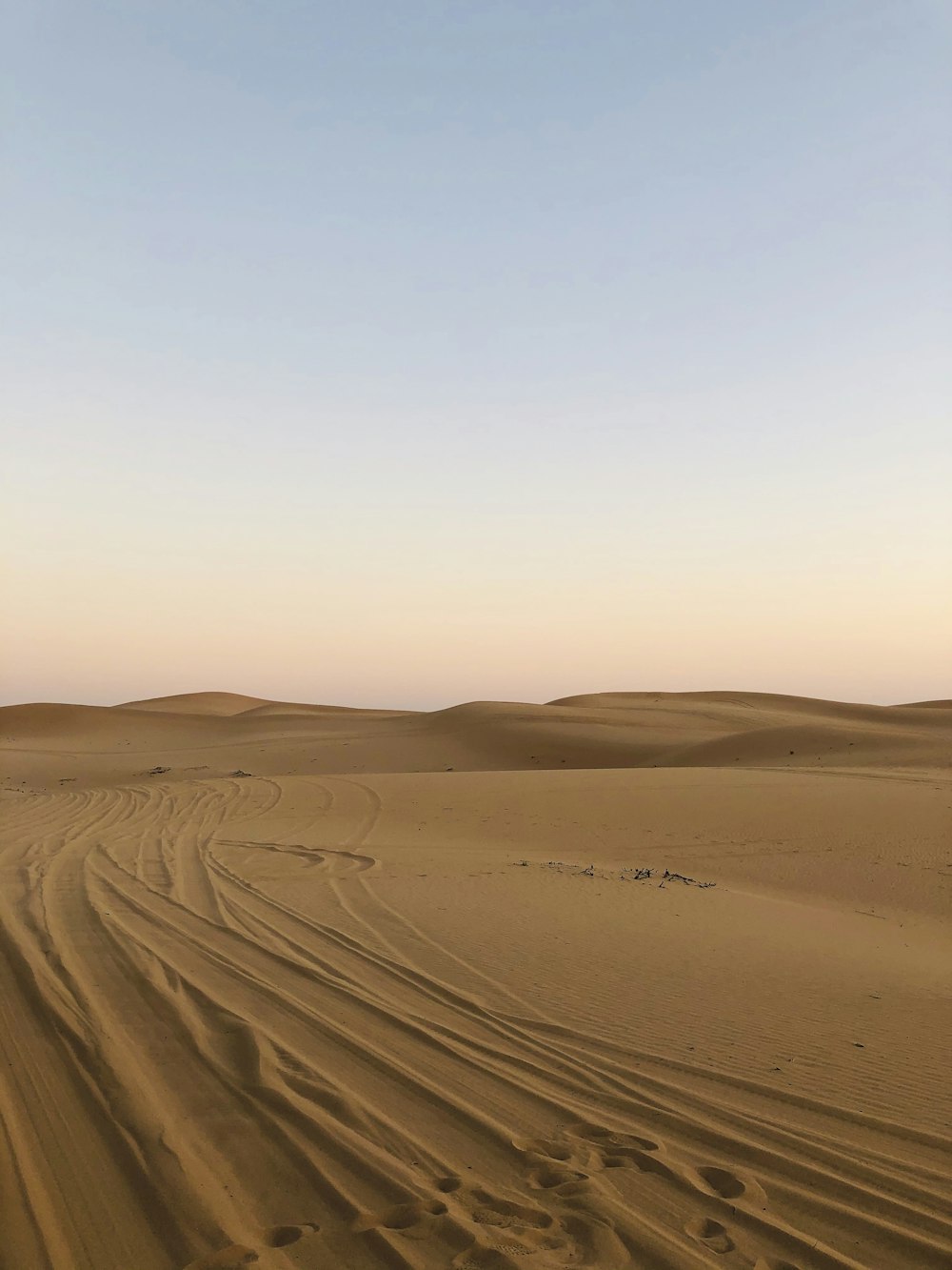 brown sand under blue sky during daytime