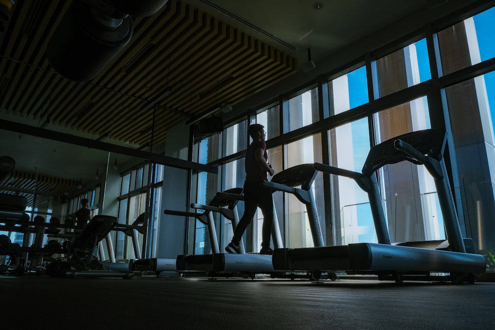 woman in black tank top and black pants doing exercise