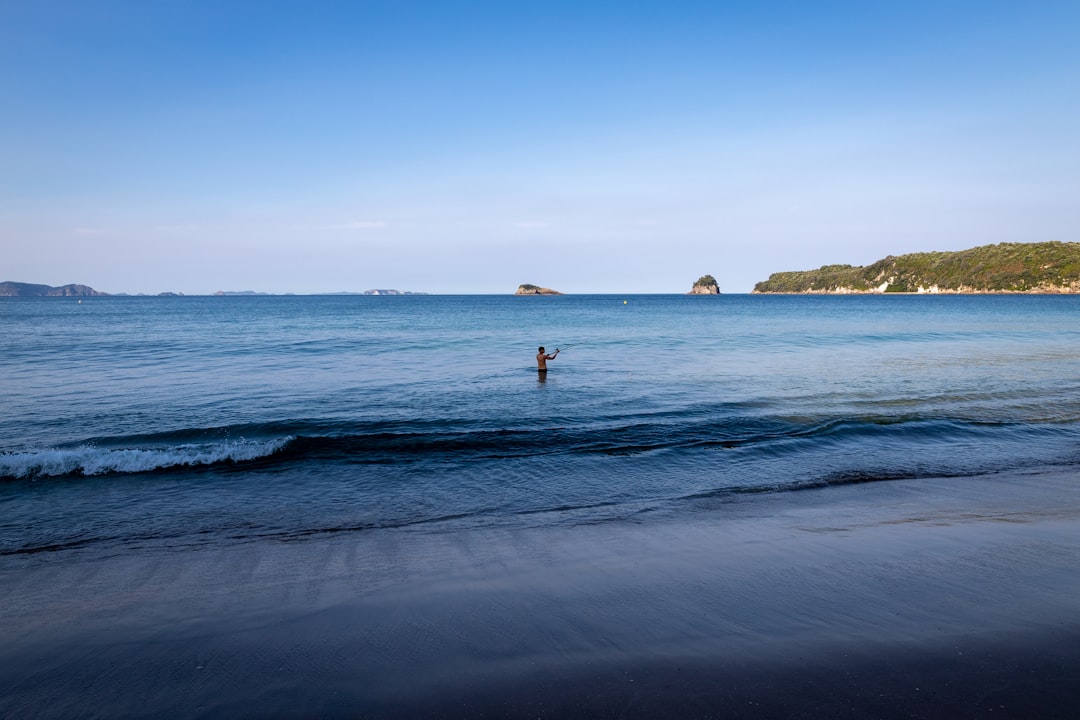 2 people in beach during daytime