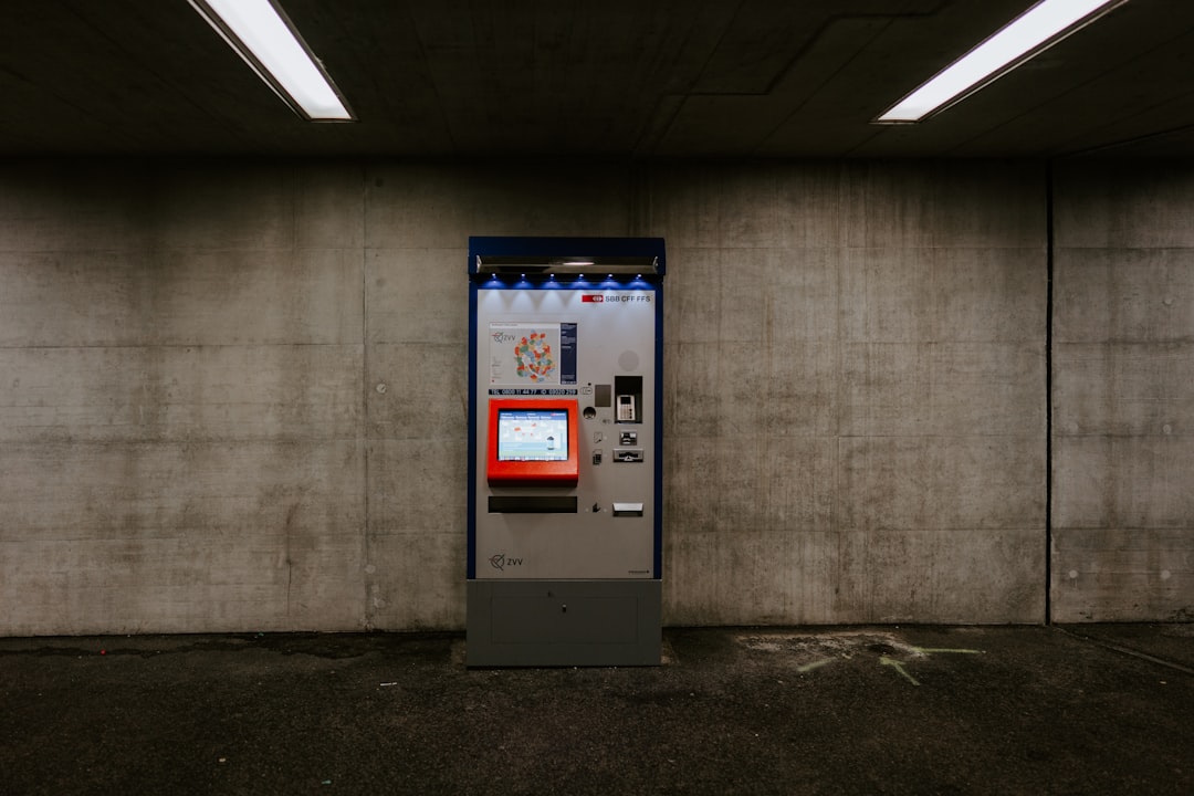 white and blue atm machine