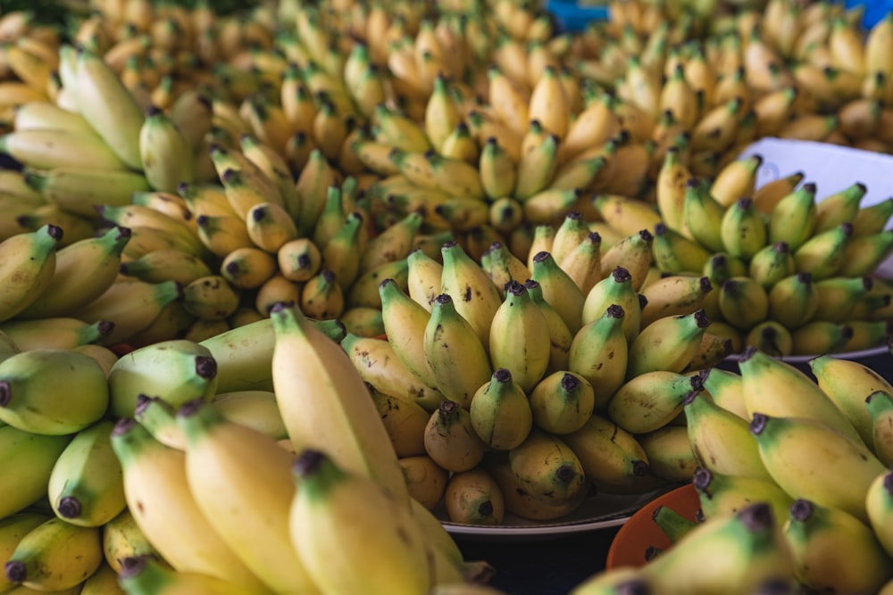 yellow banana fruit on blue textile