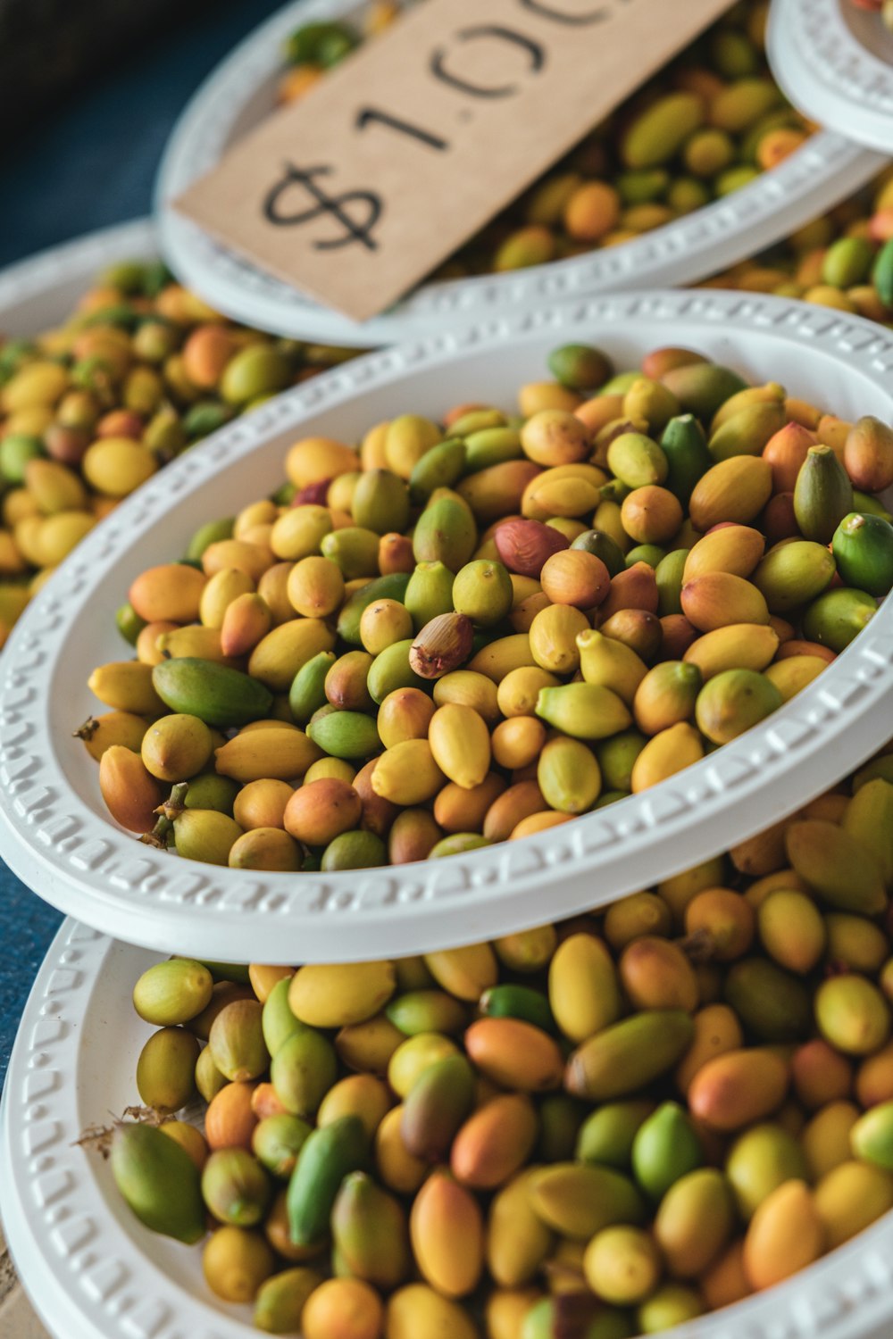 green and brown beans on white round plate