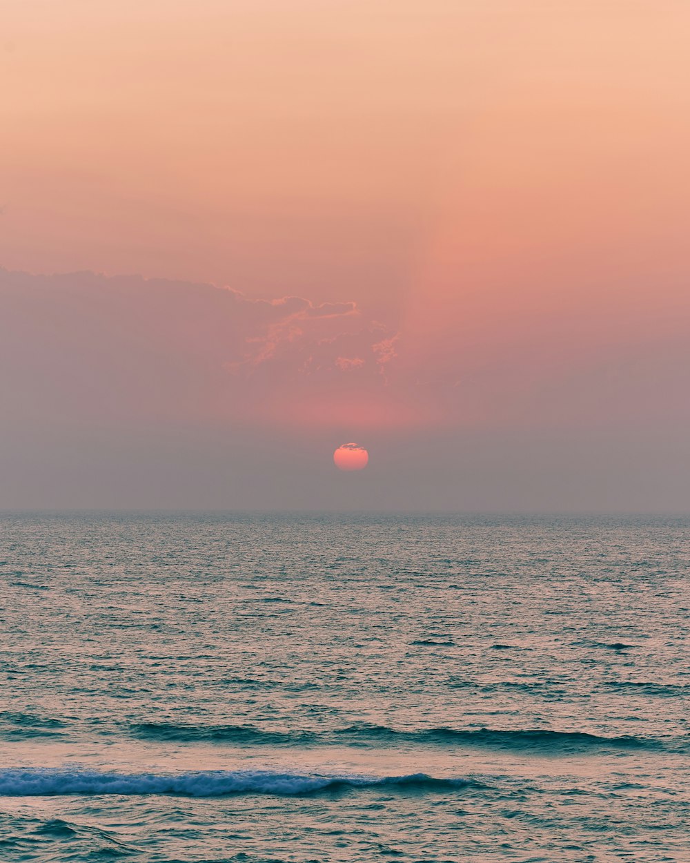 body of water during sunset