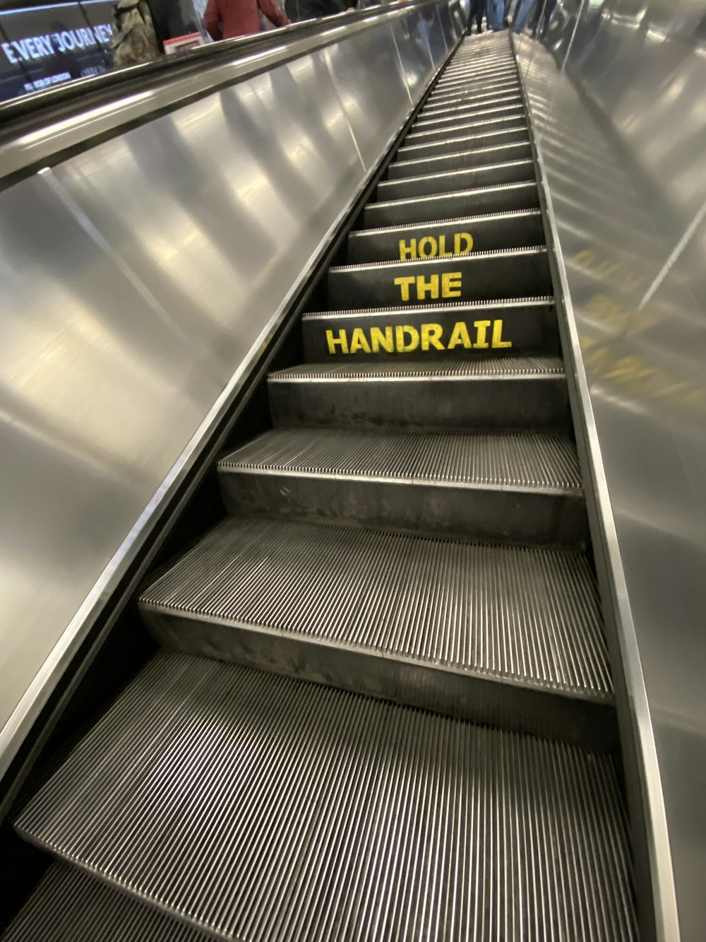 black and silver escalator in close up photography