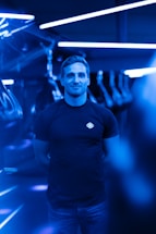 A sleek futuristic contact center with glowing blue and neon green lights