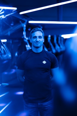 A sleek futuristic contact center with glowing blue and neon green lights