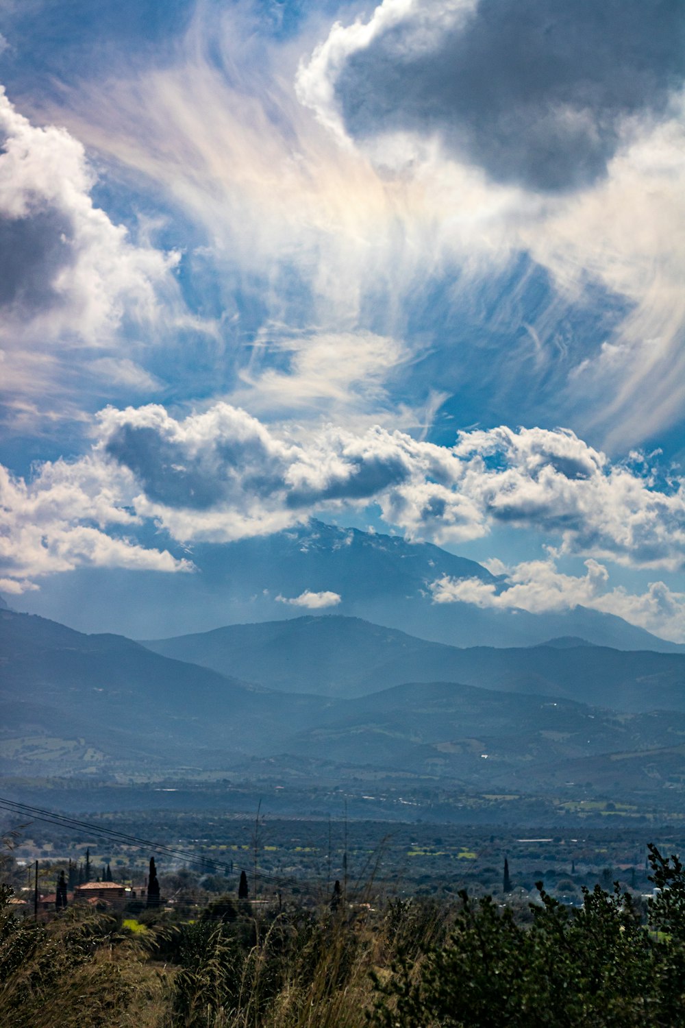 white clouds over mountains and mountains