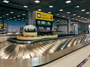 gray and black escalator inside building
