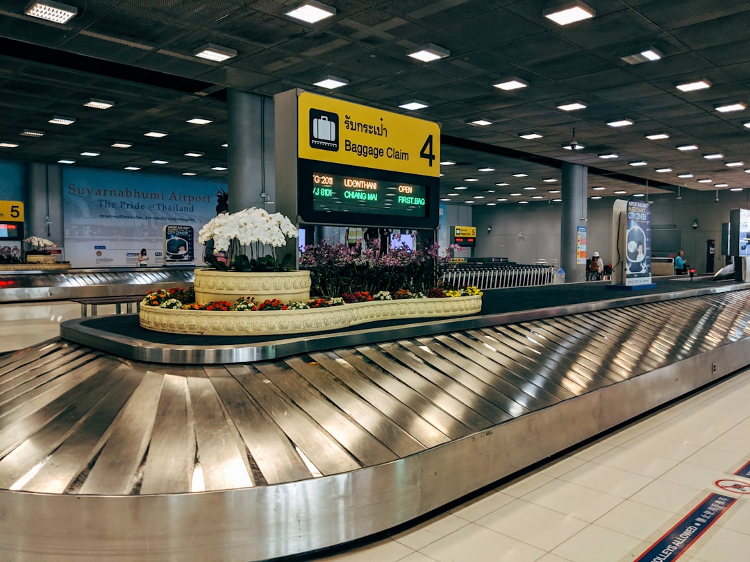 gray and black escalator inside building, Baggage Claim at Bangkok-Suvarnabhumi airport