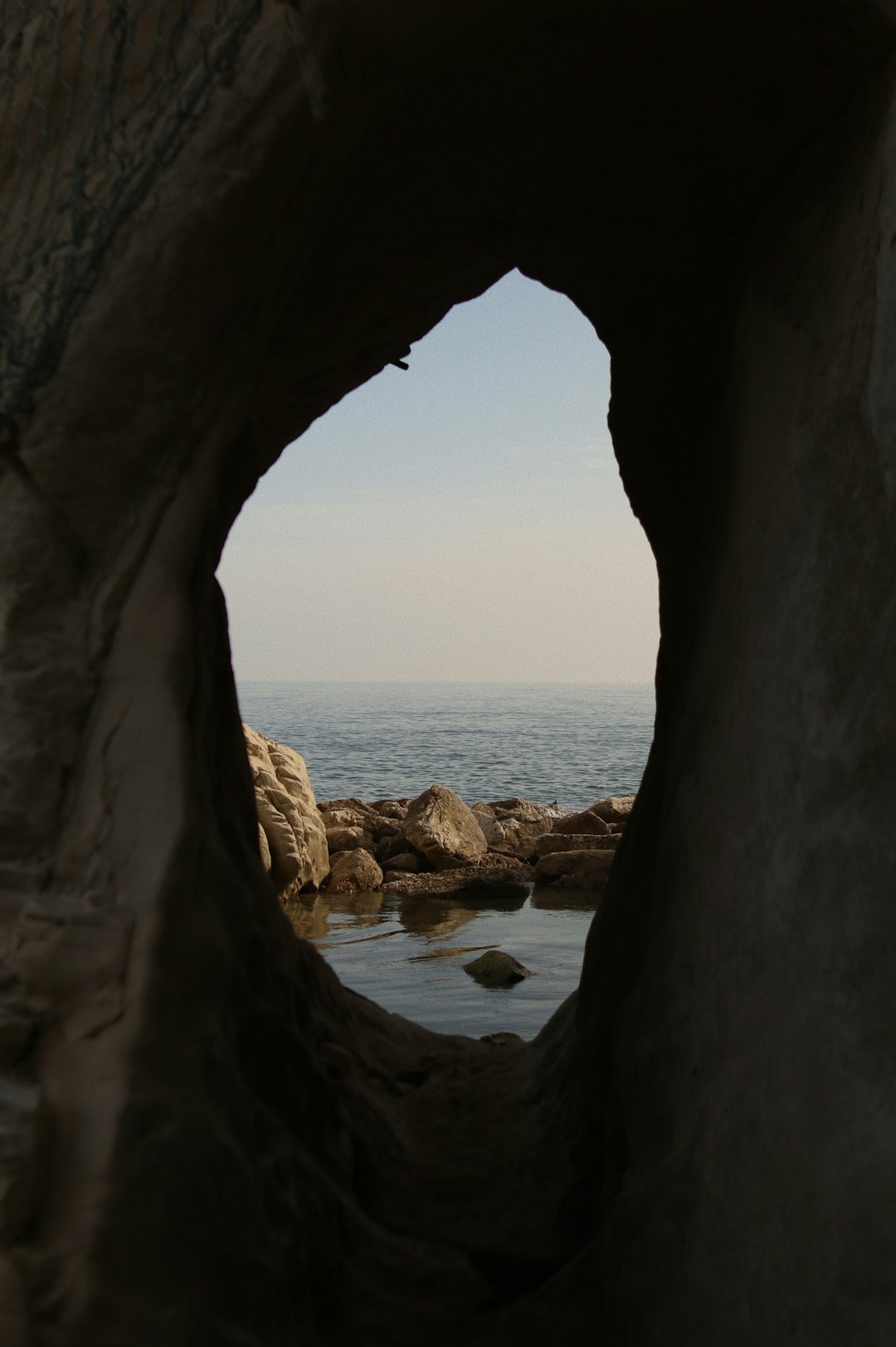 brown rock formation on sea during daytime