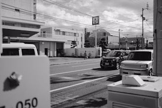 A busy street scene in Taos with parked cars.