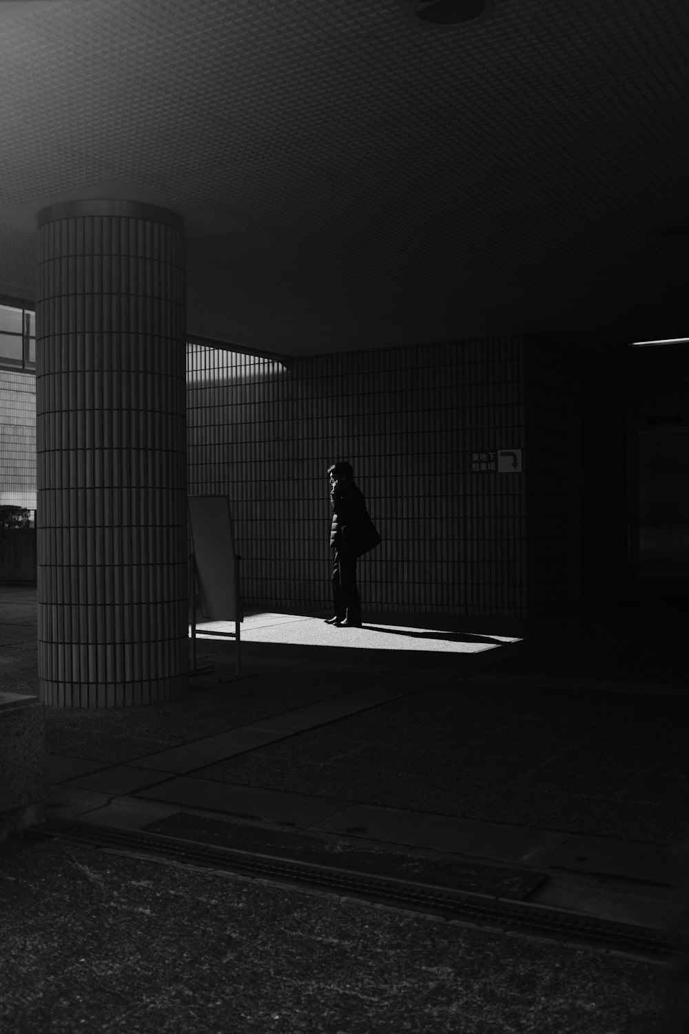 silhouette of person walking on pathway