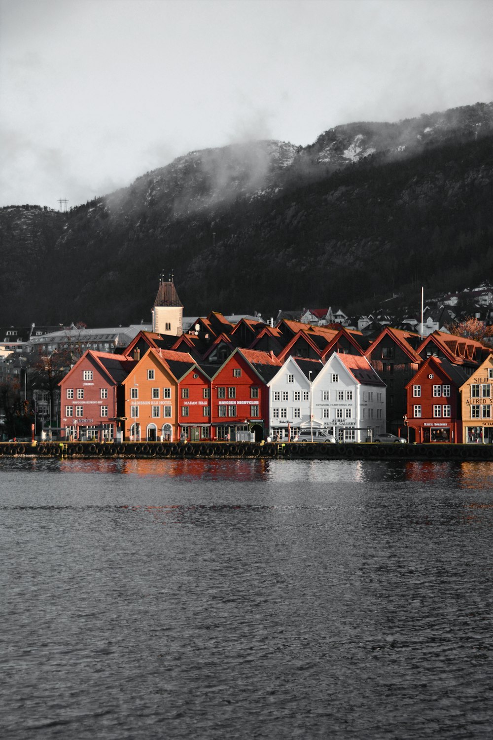 red and white house near body of water