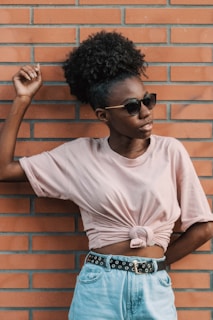 woman in white crew neck t-shirt wearing black sunglasses