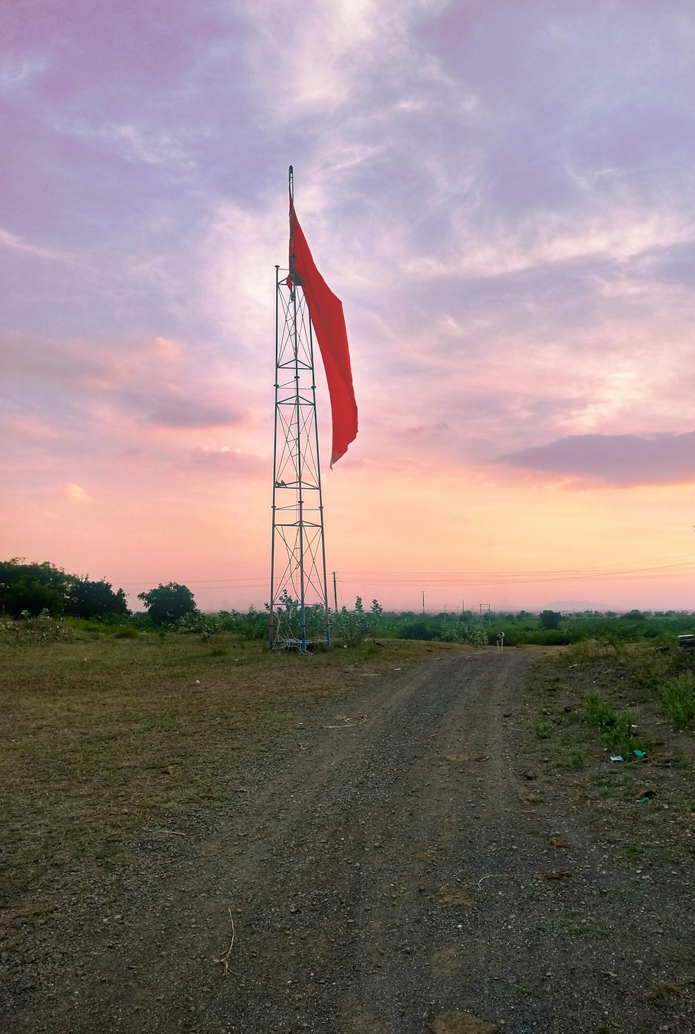 brown and white windmill under cloudy sky during daytime