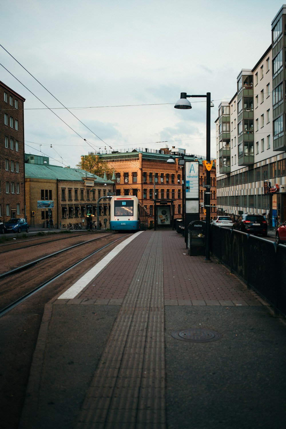 yellow and blue tram on road during night time