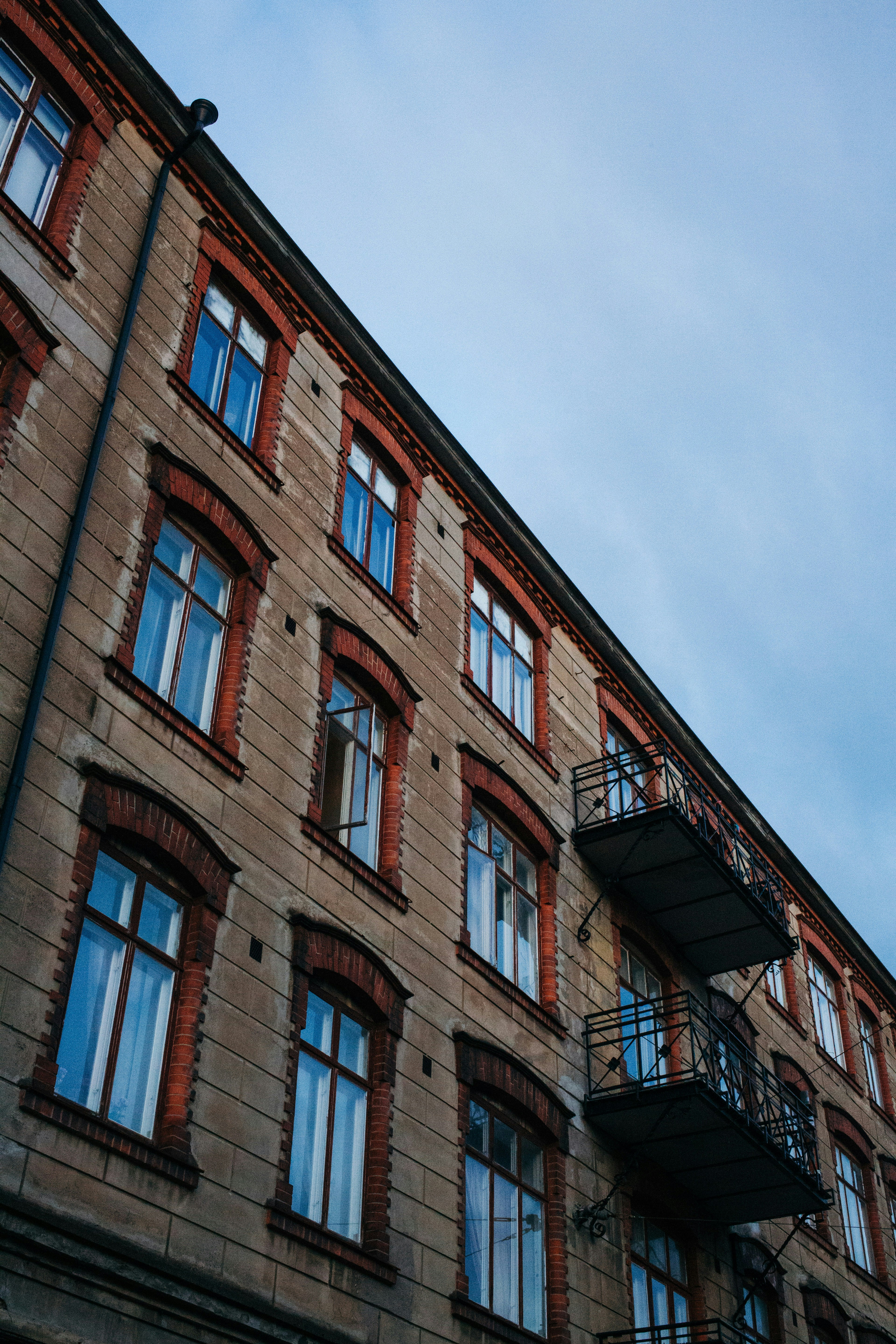 brown concrete building under blue sky during daytime