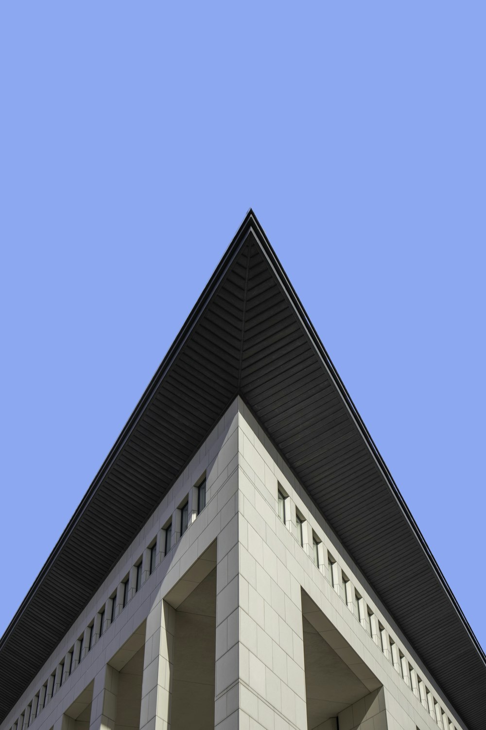 brown concrete building under blue sky during daytime