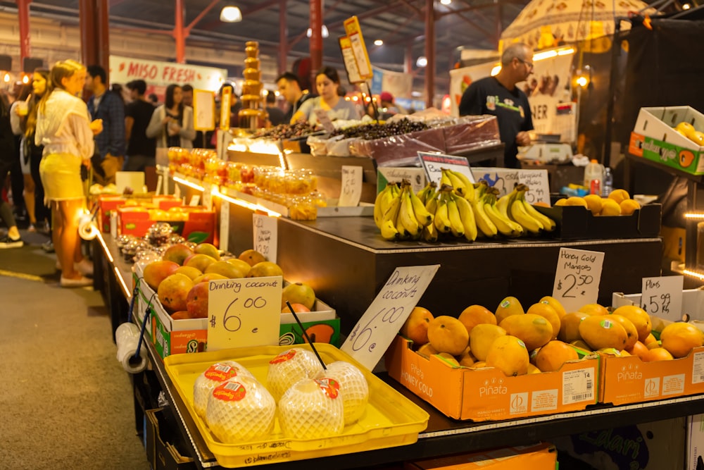 fruit stand on market during daytime