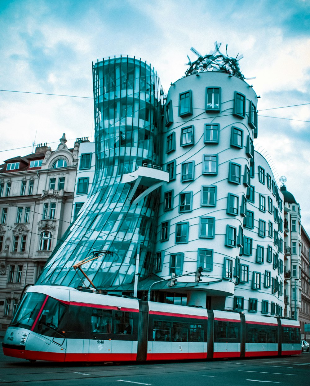 white and green bus on road near building during daytime