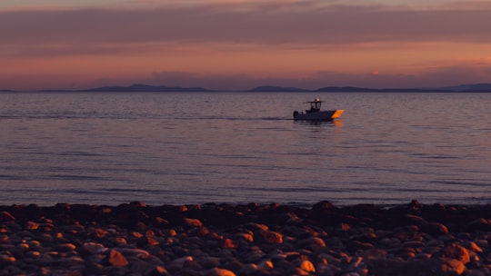 silhouette of boat on sea during sunset in Sechelt Canada