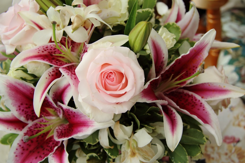 pink and white roses and white babys breath flowers