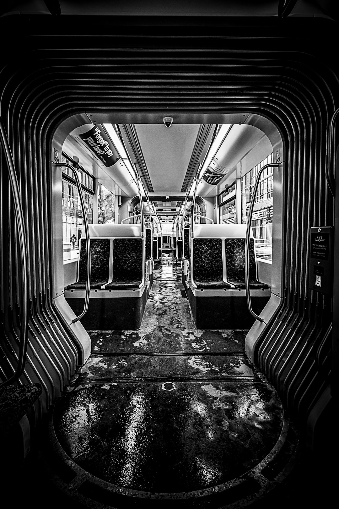 grayscale photo of train seats