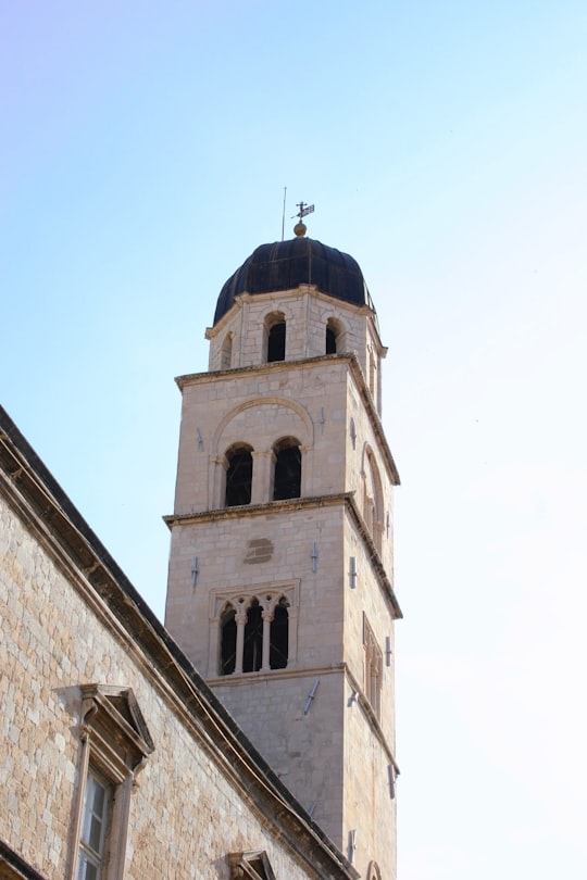 white concrete building under blue sky during daytime in Muralles de Dubrovnik Croatia