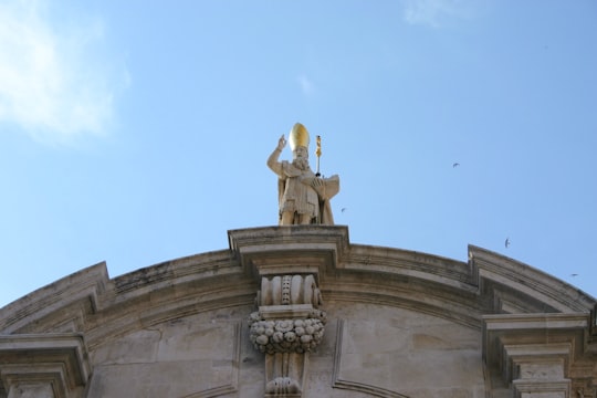 gold statue under blue sky during daytime in Church of Saint Blaise Croatia