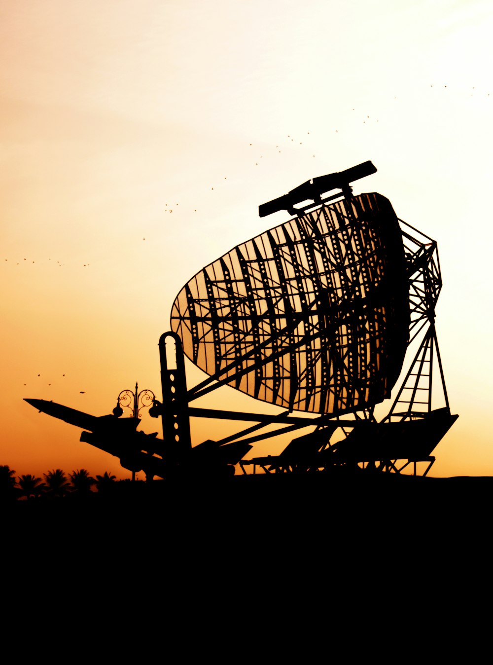 silhouette of airplane and satellite dish