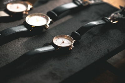 black leather strap gold round analog watch