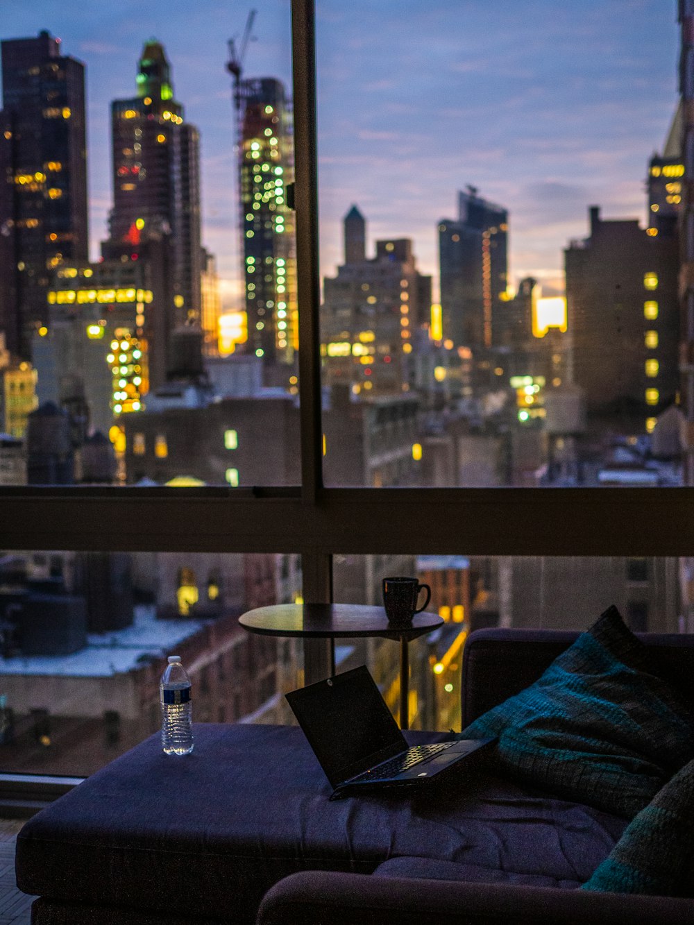 blue towel on table near glass window