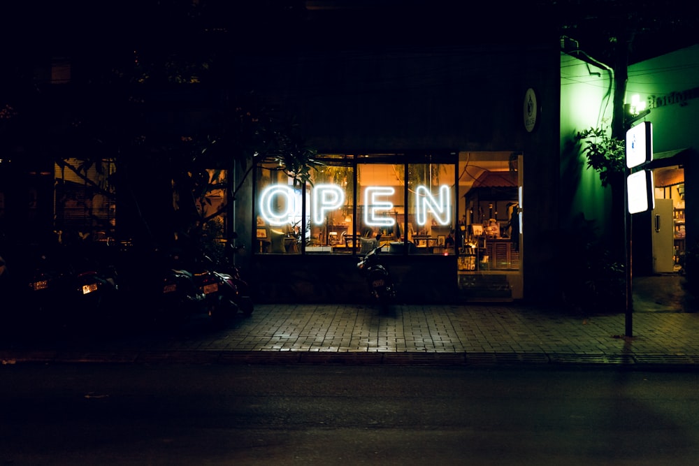 empty street with lighted string lights during night time