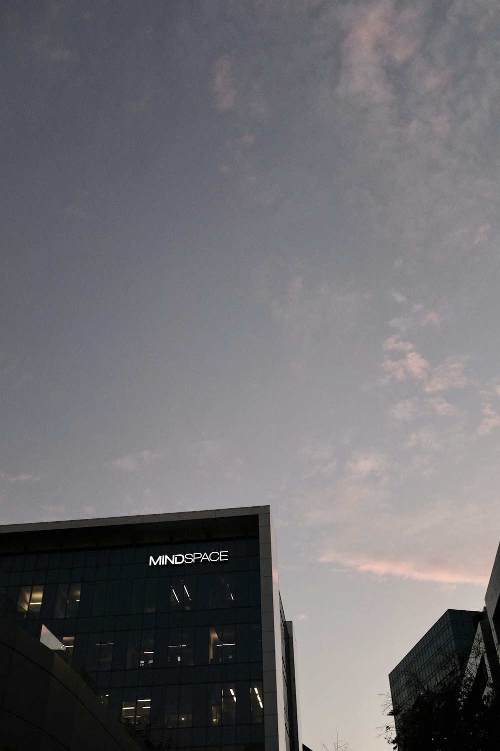 white and black building under gray sky