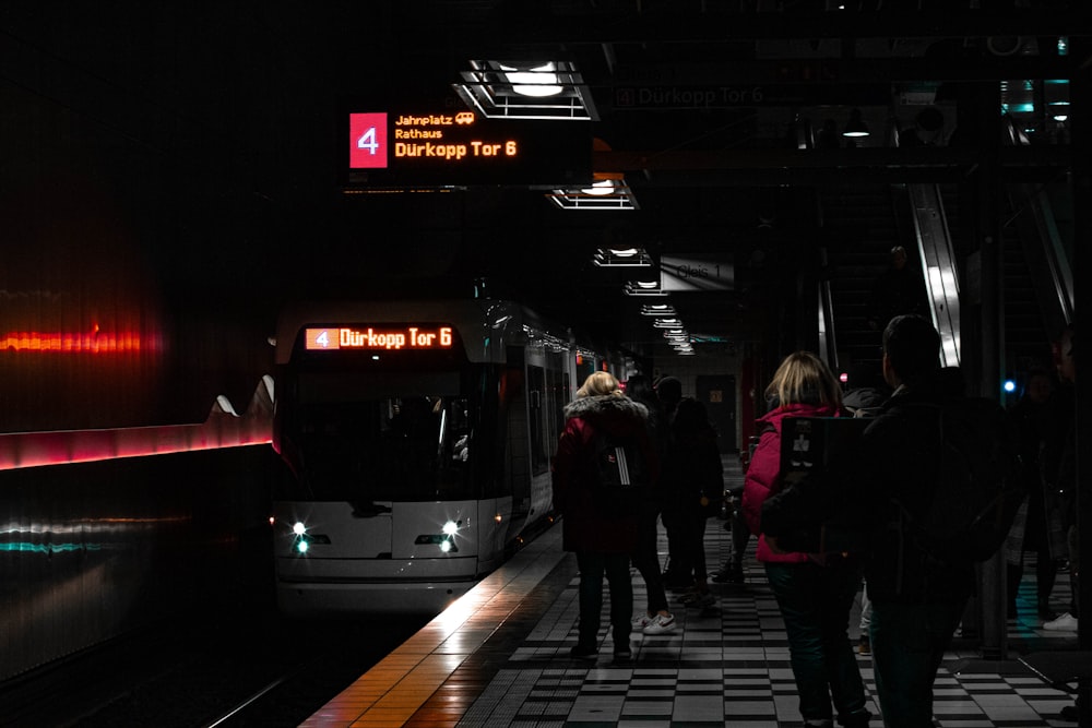 people walking on pedestrian lane during night time