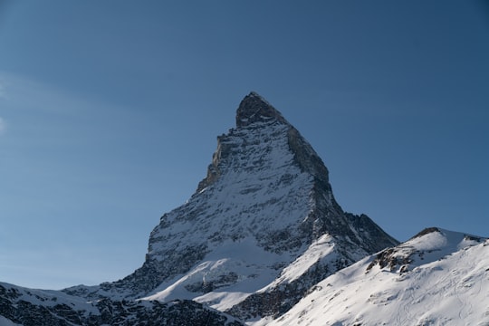 snow covered mountain under blue sky during daytime in Matterhorn Switzerland