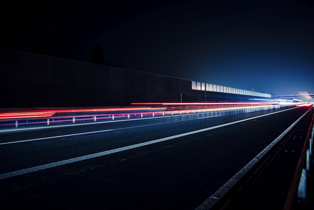 time lapse photography of cars on road during night time