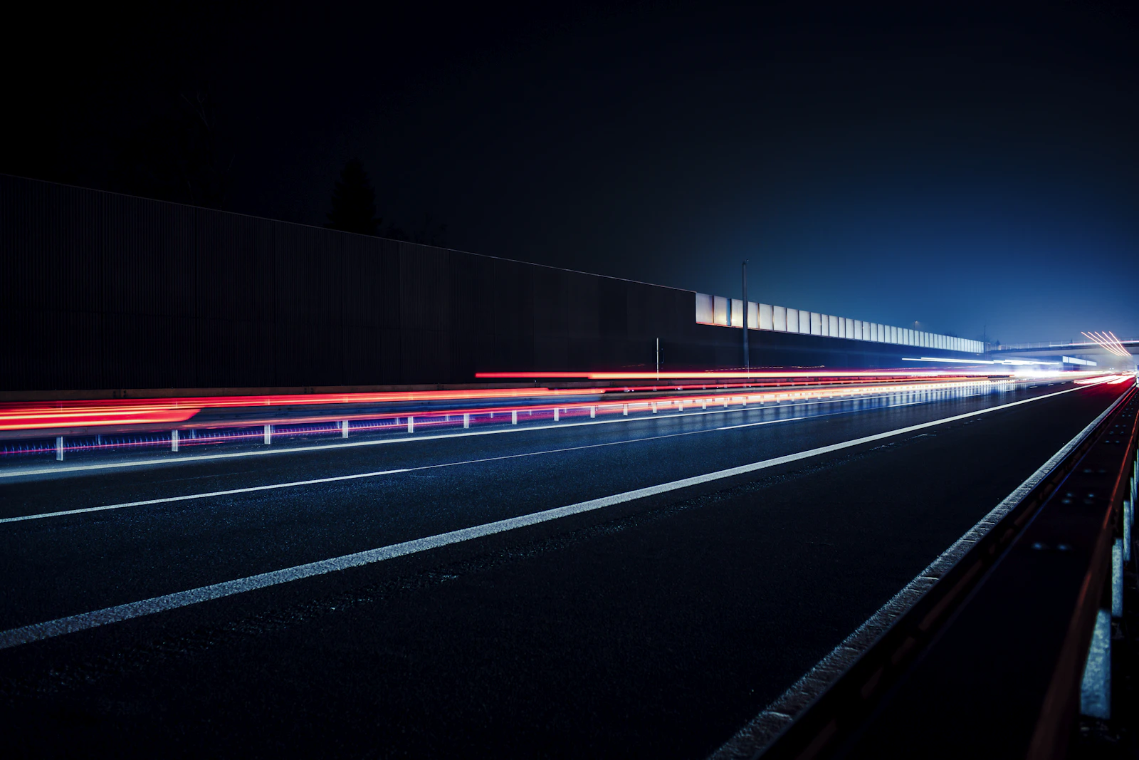 Time lapse photography of cars on road during night time