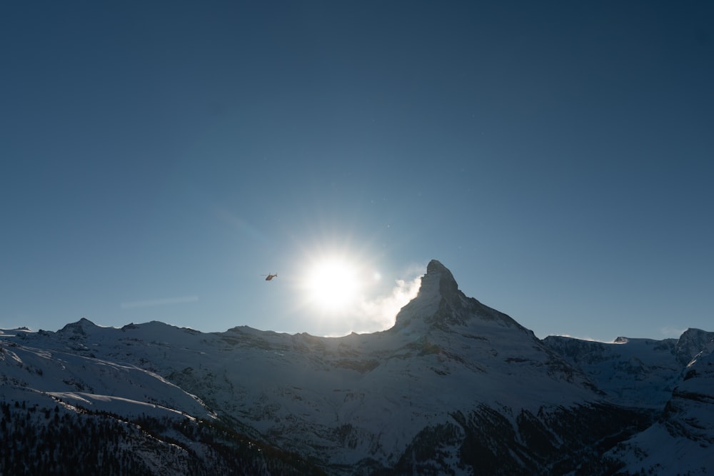 snow covered mountain under blue sky during daytime