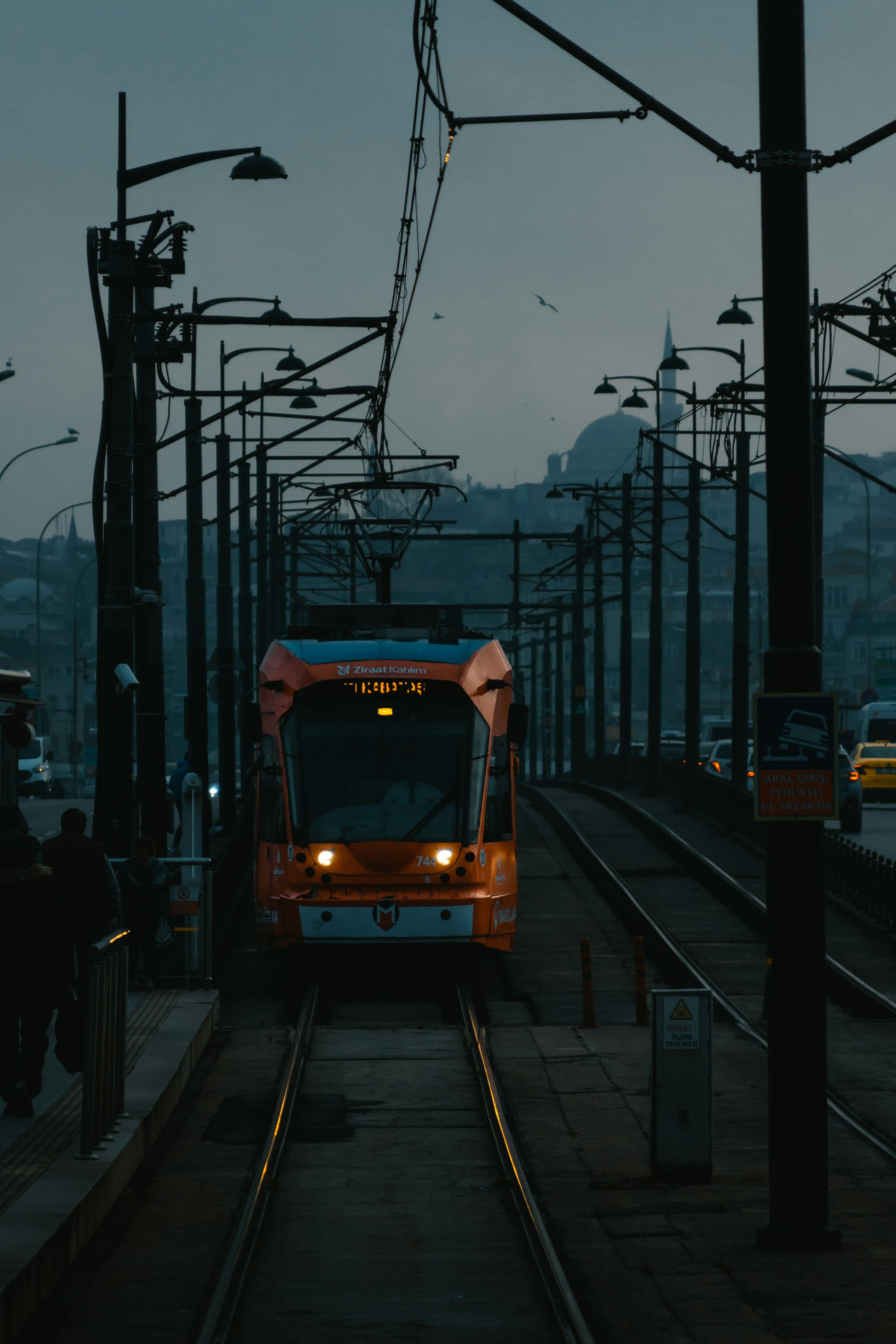 white and red tram on road during daytime