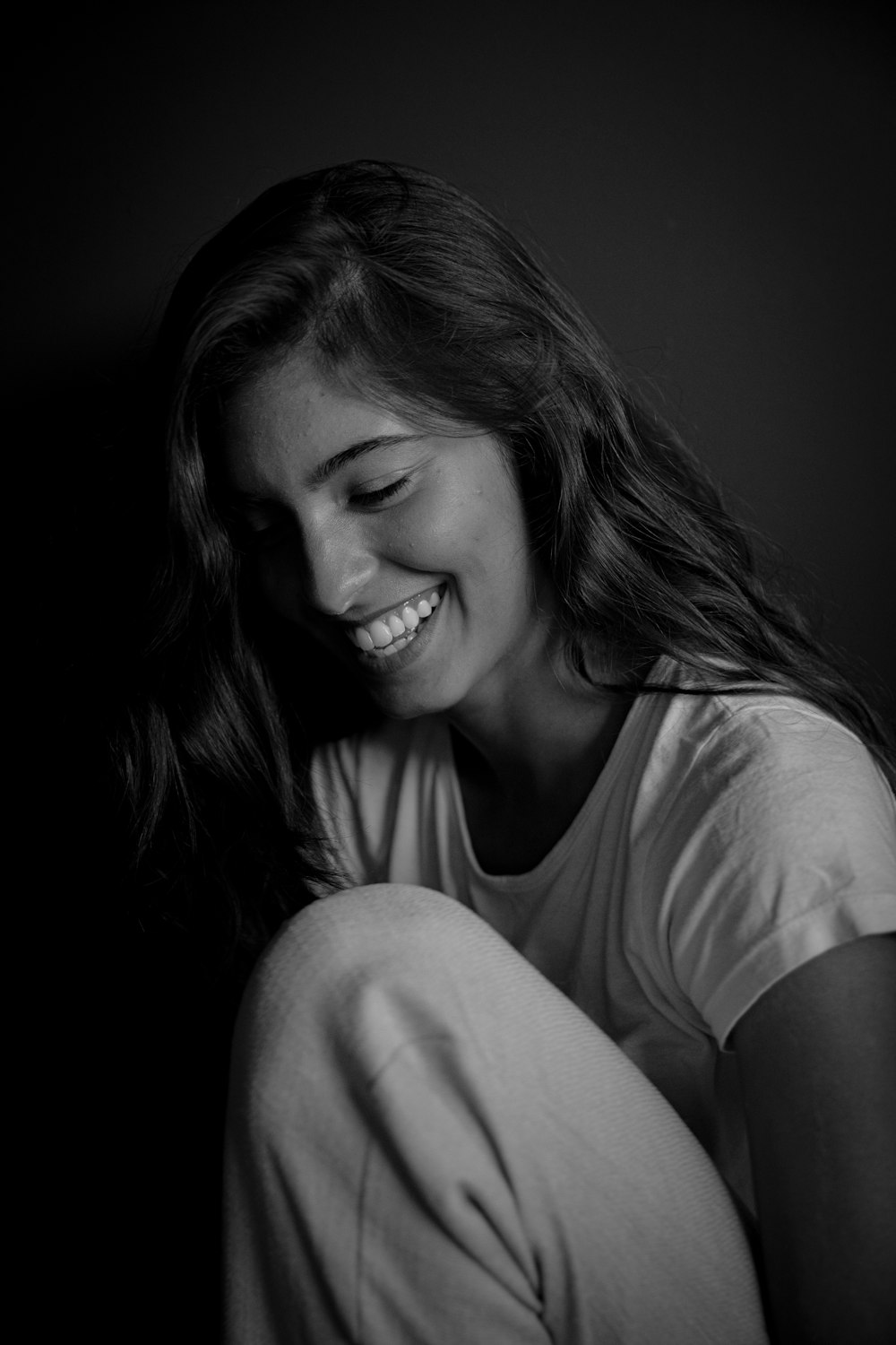 woman in white t-shirt smiling