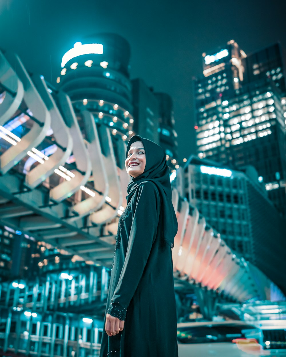 woman in black hijab standing on the street